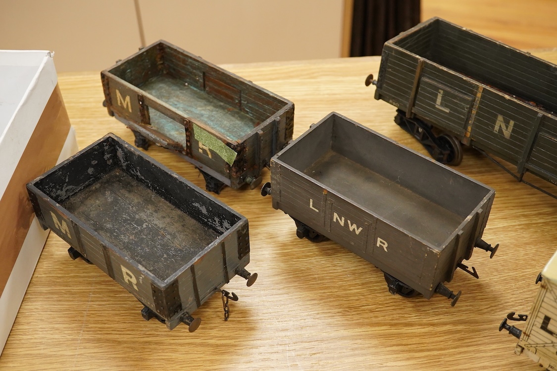 A Gauge One live steam 0-4-0T locomotive in the style of a Bowman model locomotive, with spirit fired with two simple outside oscillating cylinders, together with five LNWR and Midland Railway freight wagons, including a